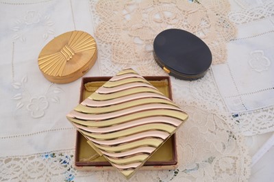 Lot 608 - Two oval 1940s Evans compacts