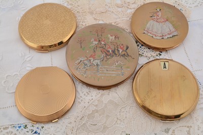 Lot 610 - Five 1950s-70s Stratton circular gilt metal Stratton compacts