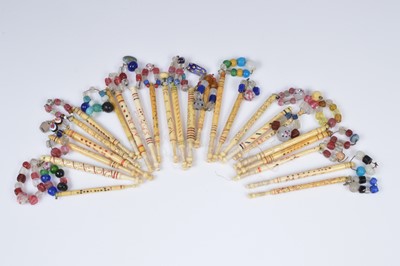 Lot 688 - A collection of twenty four named lace bobbins