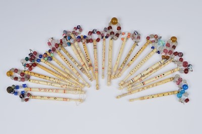 Lot 689 - A collection of twenty four named lace bobbins