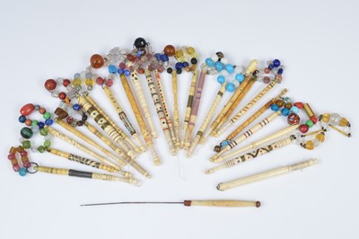 Lot 690 - A collection of twenty five decorative lace bobbins