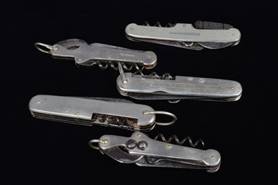 Lot 694 - A collection of five Multi-Tools/pocket knives
