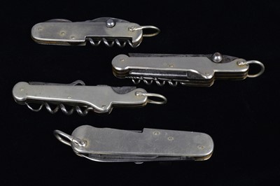 Lot 695 - A collection of four Multi-Tools/pocket knives