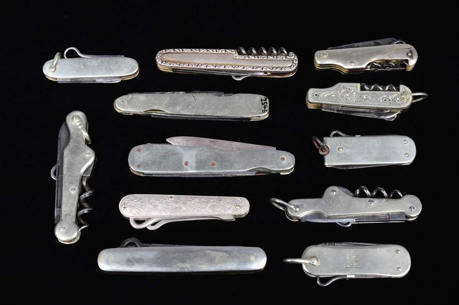 Lot 702 - An assortment of base metal and white metal Multi-Tools/Pocket Knives