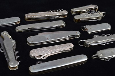 Lot 702 - An assortment of base metal and white metal Multi-Tools/Pocket Knives