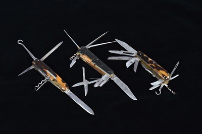 Lot 707 - A group of three Multi-Tool pocket knives