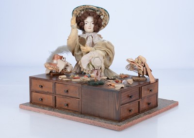 Lot 344 - A Sands Film or television theatrical property doll with milliner stall