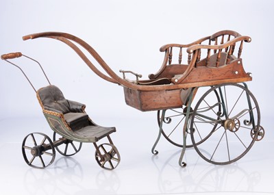 Lot 372 - A late 19th century small doll's pushchair