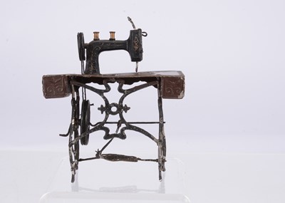 Lot 419 - A German larger scale dolls’ house soft metal sewing machine