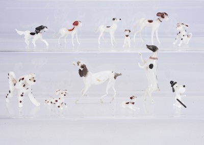 Lot 427 - Two 19th century Lauscha milk glass dogs