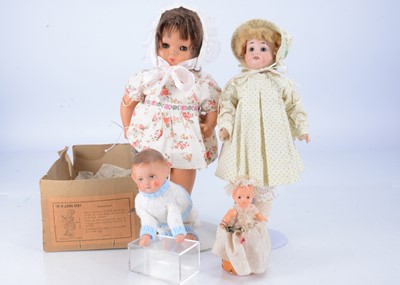 Lot 583 - Four clockwork and walking dolls