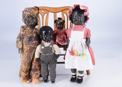 Lot 594 - Three black walker dolls