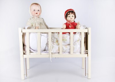 Lot 618 - A white wooden doll’s cot and large AW composition baby