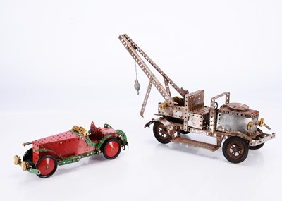 Lot 694 - A Meccano clockwork operated Crane Lorry and Open Top Racing Car (2)