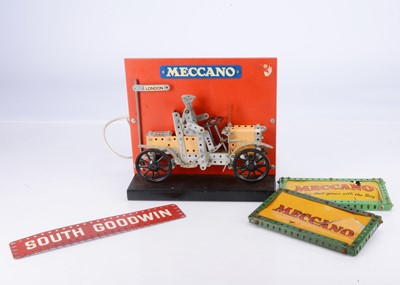 Lot 695 - An electrically operated  Meccano shop display featuring  a sectioned model of a Veteran Car and two Meccano Panels possibly for back Illumination and a South Goodwin Sign (4) 