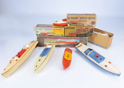 Lot 698 - Eight boxed and unboxed Meccano Hornby clockwork Tin boats (8)
