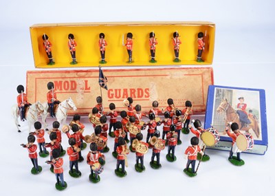 Lot 718 - Timpo hollow-cast British Guards including rare boxed MODEL TOYS LTD. 7pce Set 303 'Model Guards' guards at present, with flock-covered bearskins
