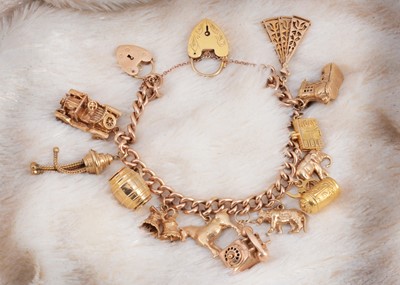 Lot 5 - A 9ct gold multi charm set bracelet