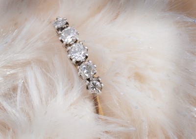 Lot 24 - A five stone old cut diamond 18ct gold and platinum set dress ring