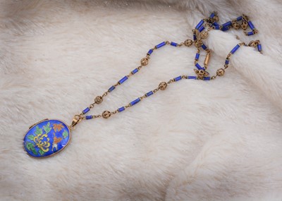 Lot 43 - A Chinese silver gilt and enamel oval locket
