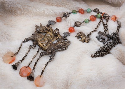 Lot 44 - A Chinese white metal and hardstone figural necklace