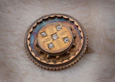 Lot 71 - A Victorian diamond set target brooch