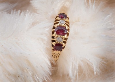 Lot 92 - An 18ct gold ruby and diamond five stone dress ring