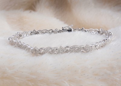 Lot 98 - A 9ct gold diamond set line bracelet