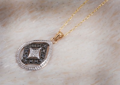 Lot 100 - An oval diamond encrusted openwork pendant