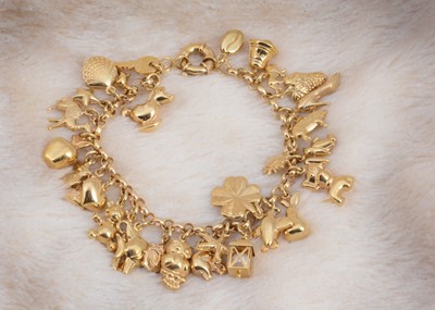 Lot 106 - A 9ct gold charm bracelet