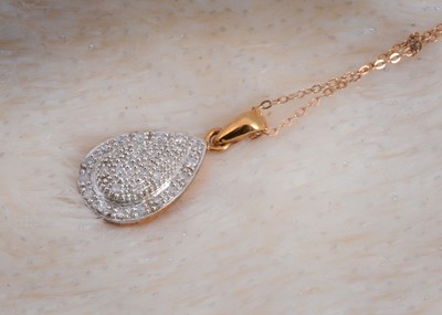 Lot 108 - A diamond encrusted tear shaped pendant