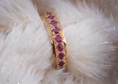 Lot 119 - A 9ct gold ruby full eternity ring
