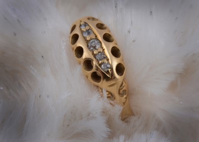 Lot 124 - An 18ct gold yellow metal old cut diamond dress ring