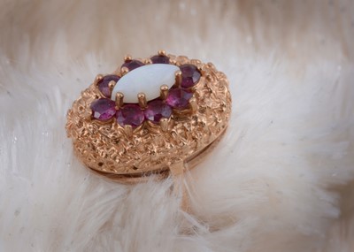 Lot 127 - A 9ct gold ruby and opal dress ring