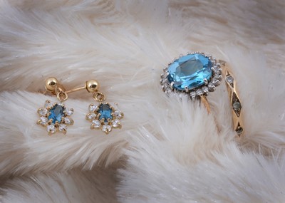 Lot 134 - A 9ct gold topaz and diamond cluster ring