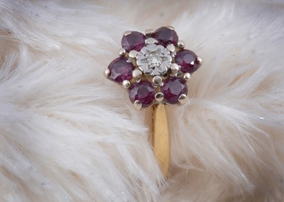 Lot 142 - An 18ct gold hexagonal ruby and diamond dress ring