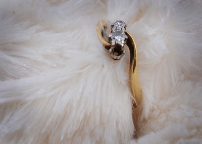 Lot 144 - An 18ct gold three stone dress ring