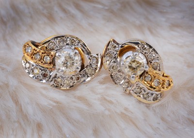Lot 150 - A pair of yellow metal diamond set ear studs