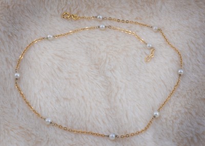 Lot 166 - An 18ct gold and pearl necklace