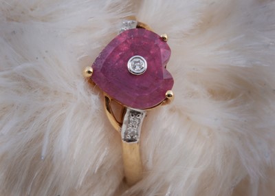 Lot 176 - A 9ct gold ruby and diamond heart shaped dress ring