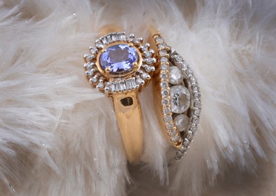 Lot 180 - Two 18ct gold diamond set dress rings