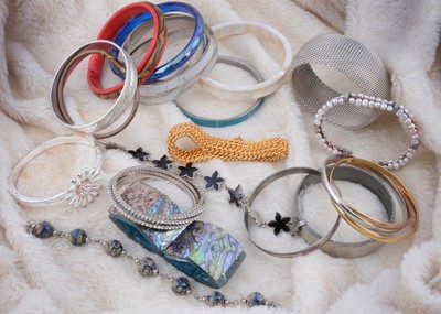 Lot 209 - A large collection of bangles, costume rings, necklaces