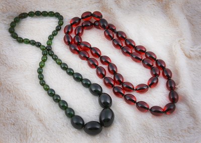 Lot 215 - A string of 'Cherry Amber' translucent beads