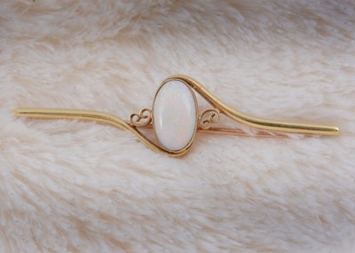 Lot 235 - An Edwardian 15ct gold precious opal bar brooch