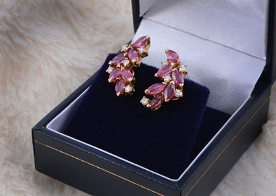 Lot 247 - A pair of ruby and diamond leaf style earrings