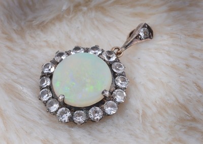 Lot 251 - An opal and white sapphire pendant