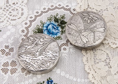 Lot 283 - Two circular hinged compacts