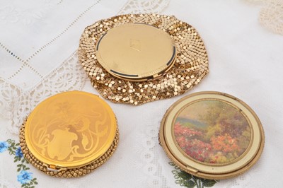 Lot 306 - Three gilt Evans and Evans style compacts