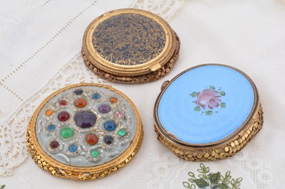 Lot 307 - Three gilt Evans and Evans style compacts