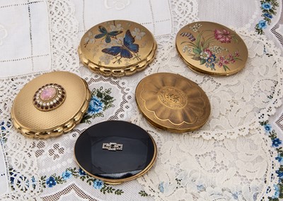 Lot 333 - Five oval gilt metal Kigu compacts c1950s and later